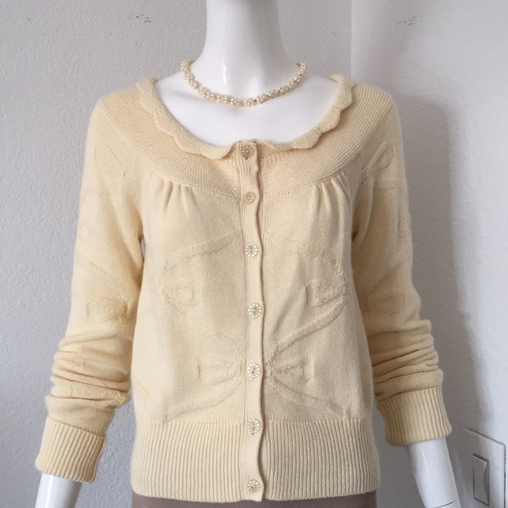 Anthropologie ivory bow Sweater